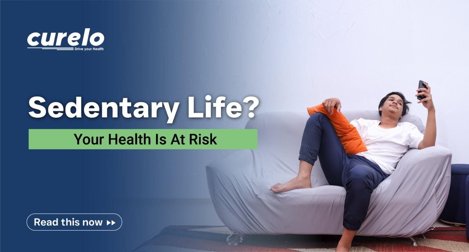 A young man sitting on a sofa using a phone, illustrating the risks of a sedentary lifestyle.