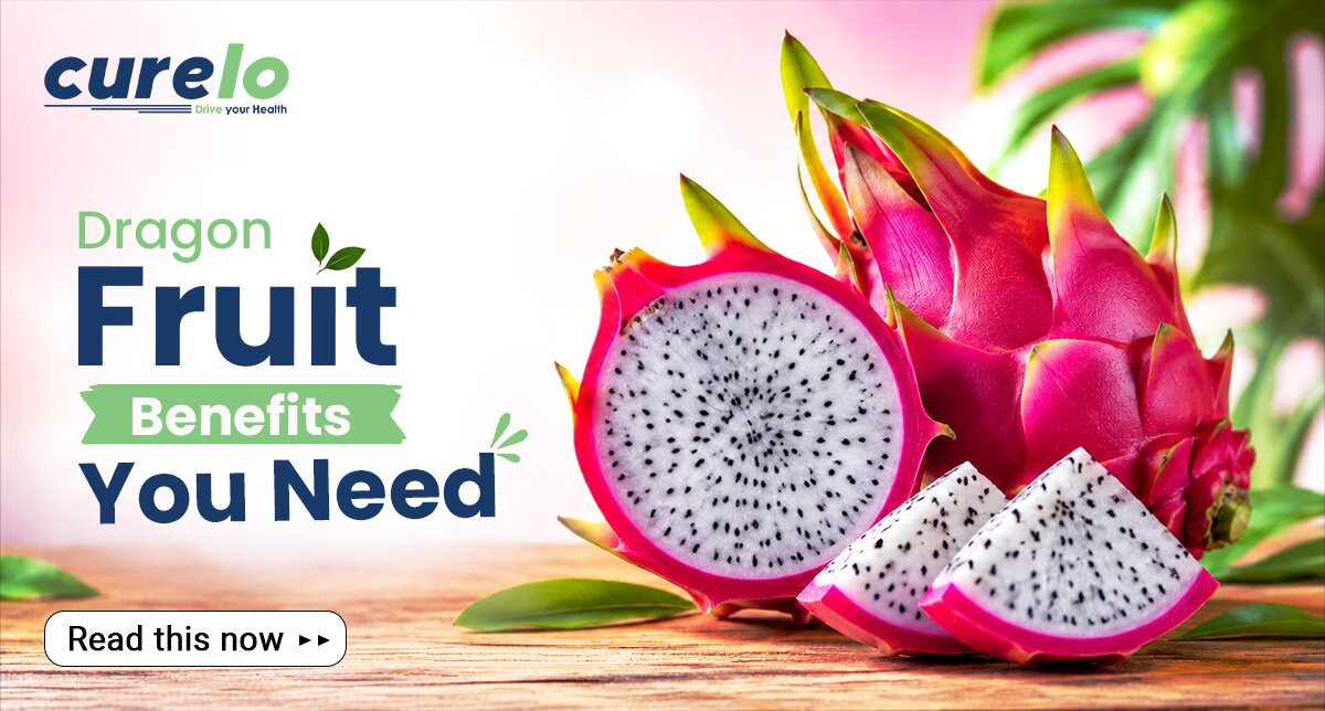 Fresh dragon fruit sliced open showing pink skin and white flesh with black seeds